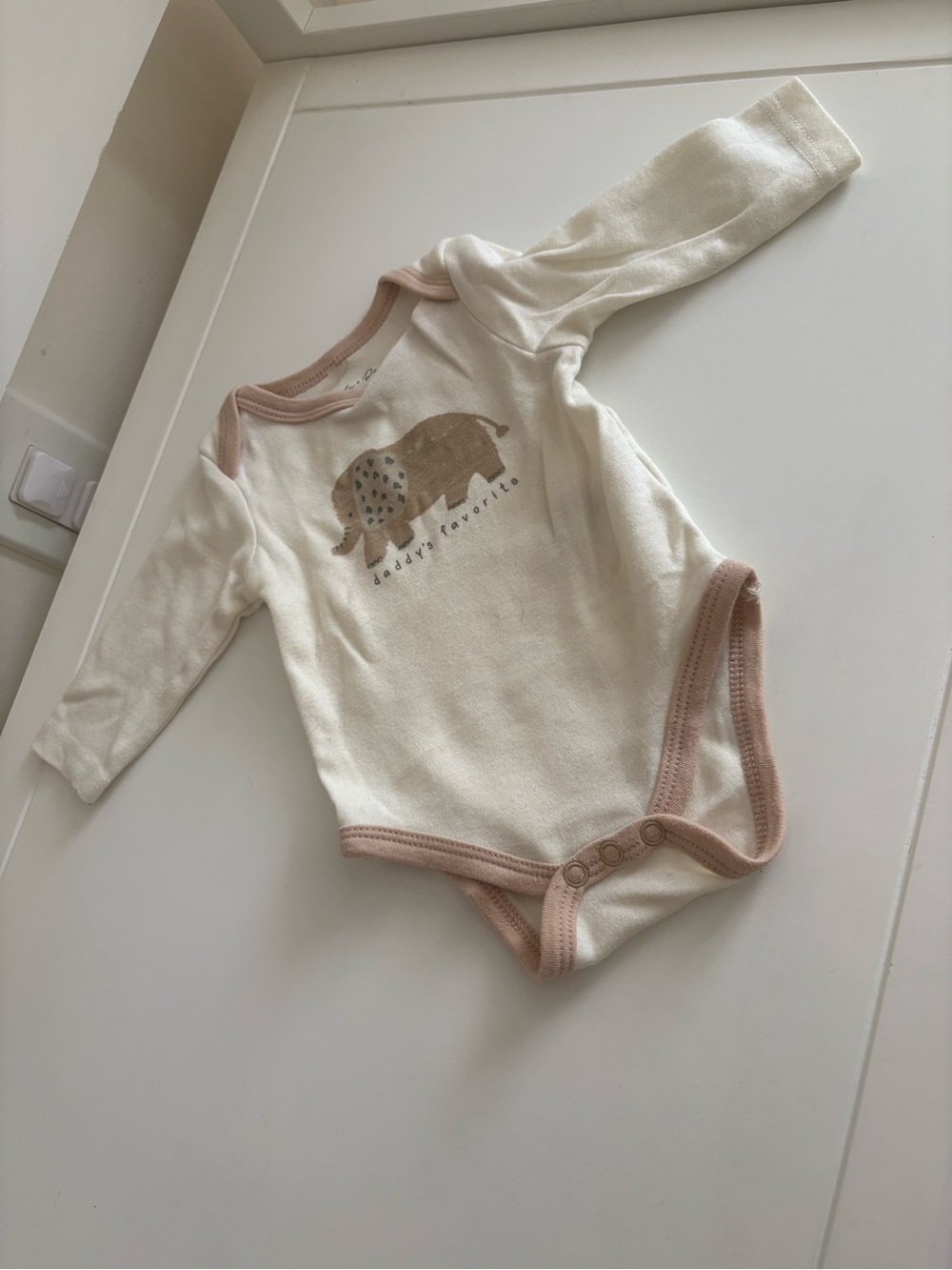 Cream Long-Sleeve Baby Bodysuit with Beige Trim and Elephant Graphic